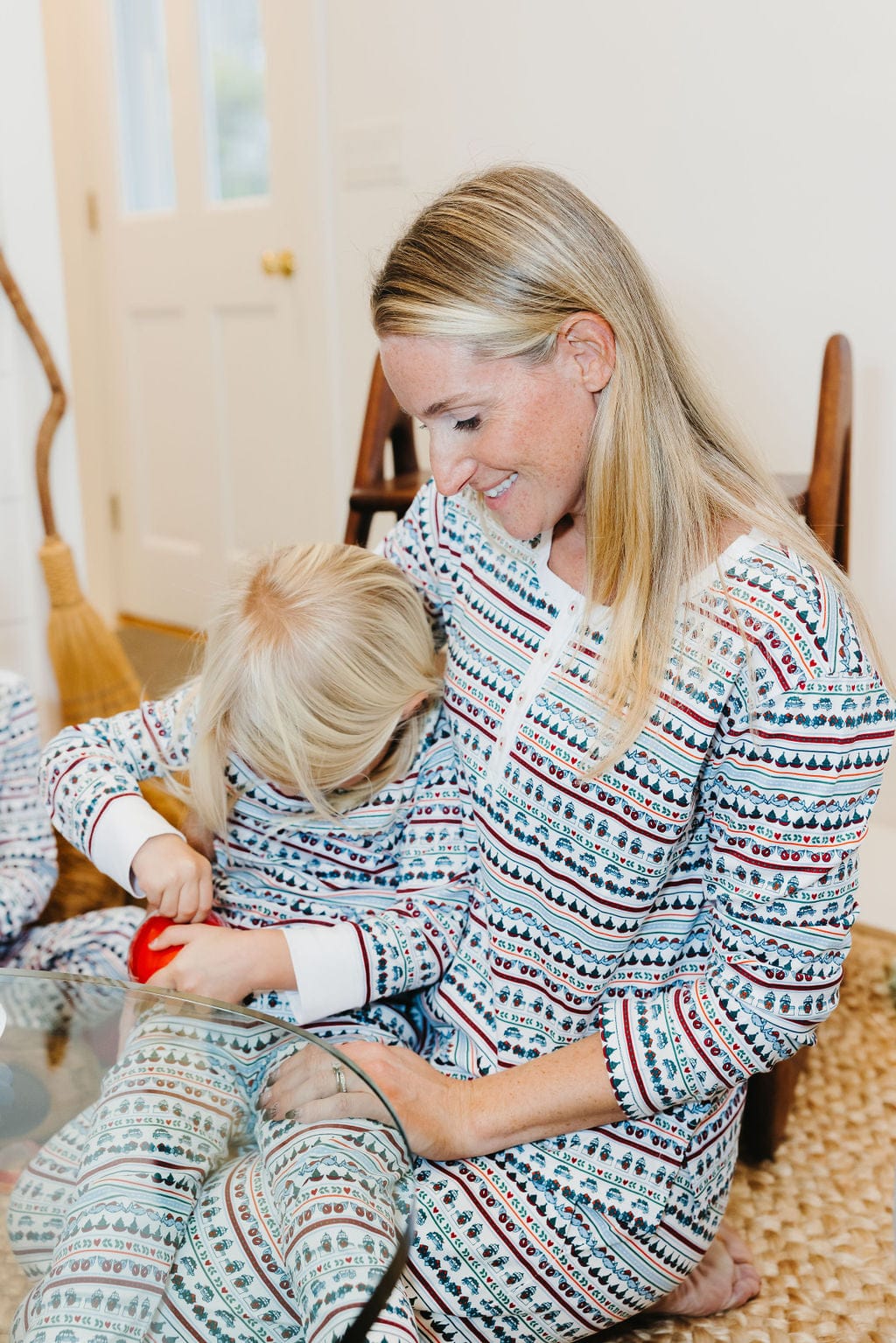 A sweet and heartwarming moment captured as a mother and her son, both wear cozy pajamas